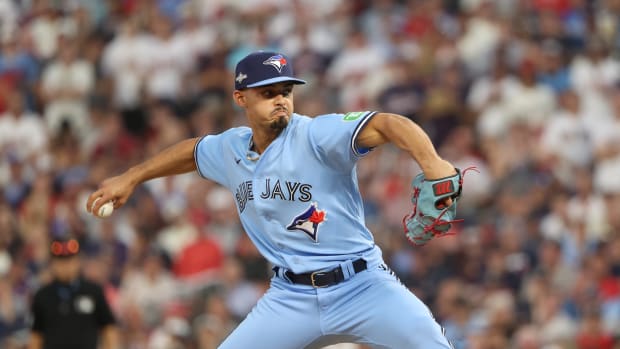 Oct 3, 2023; Minneapolis, Minnesota, USA; Toronto Blue Jays relief pitcher Jordan Hicks (12) pitches in the in the eighth inning against the Minnesota Twins during game one of the Wildcard series for the 2023 MLB playoffs at Target Field. Mandatory Credit: Jesse Johnson-USA TODAY Sports